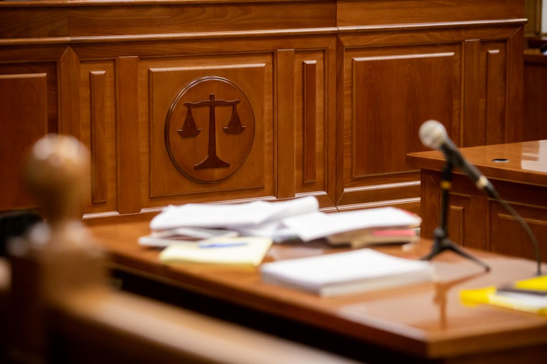 South Carolina statute of limitations. Court room with scales of justice on wall.