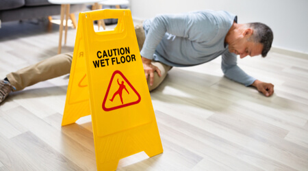 A person who slipped and fell on a wet floor