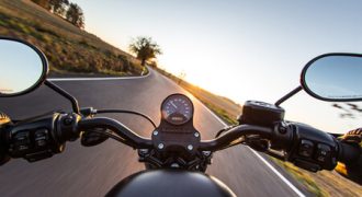 Riding a motorcycle on a country road