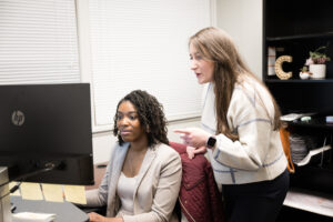 Attorney talking to her case manager about a case