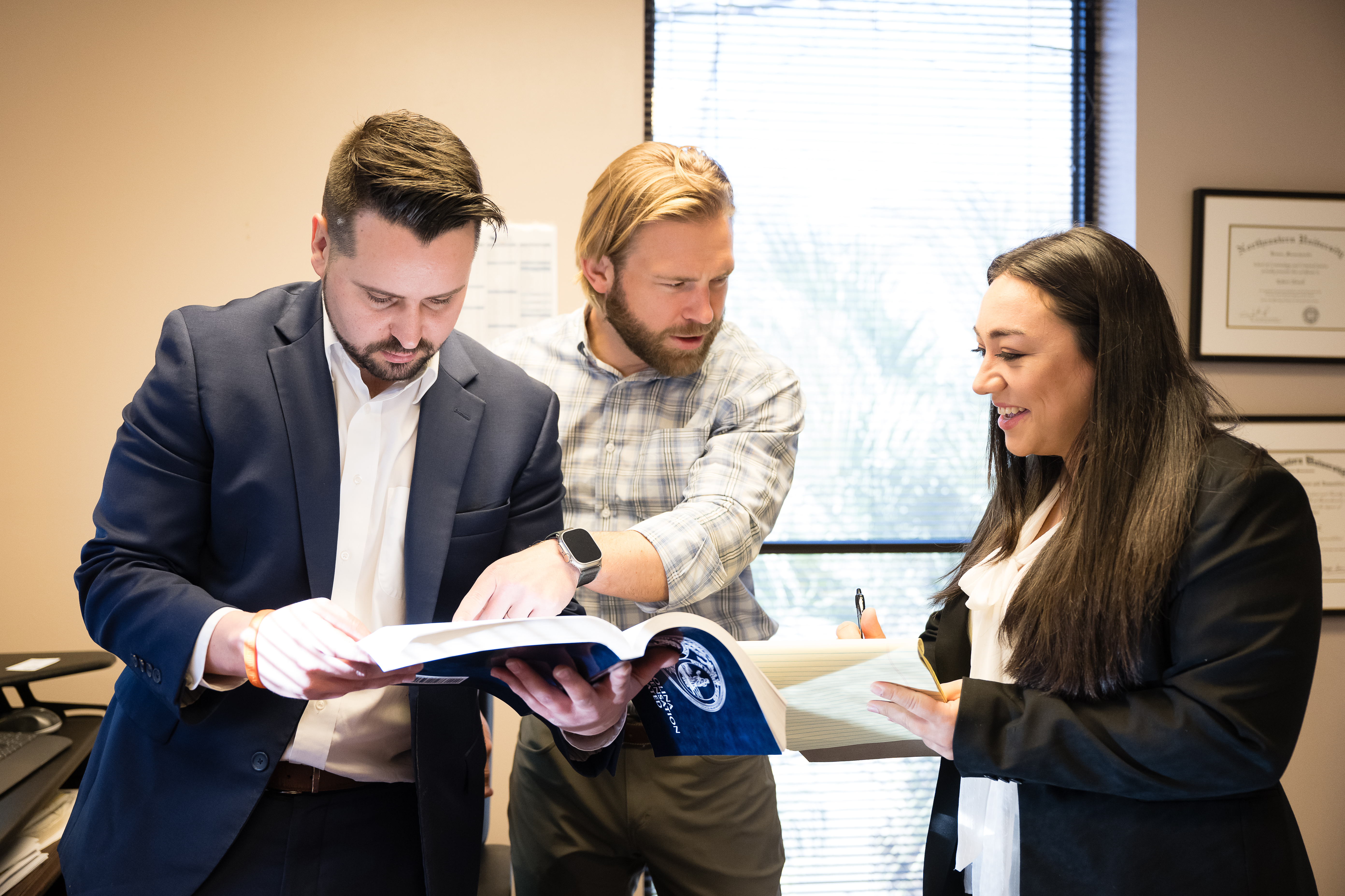 Three attorneys discussing a case