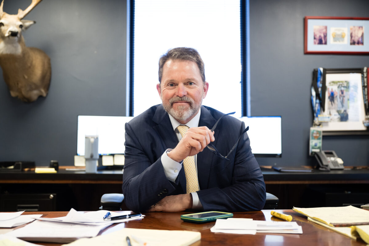 Mark Joye sitting at his desk