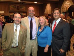 Joye Law Firm Attorneys Jeff Gerardi, Matt Jackson, and Ken Harrell pose with Kay Hyman, Senior Director of Community Engagement, at the 139th Annual Meeting of the Charleston Animal Society