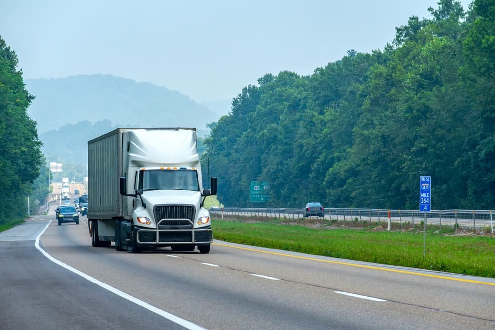 semi truck and vehicles driving on highway