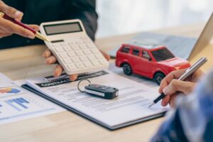 Car Dealerships and Customers Signing Car Insurance or Rental Agreements: Coordinating to manage transportation and financing costs effectively.